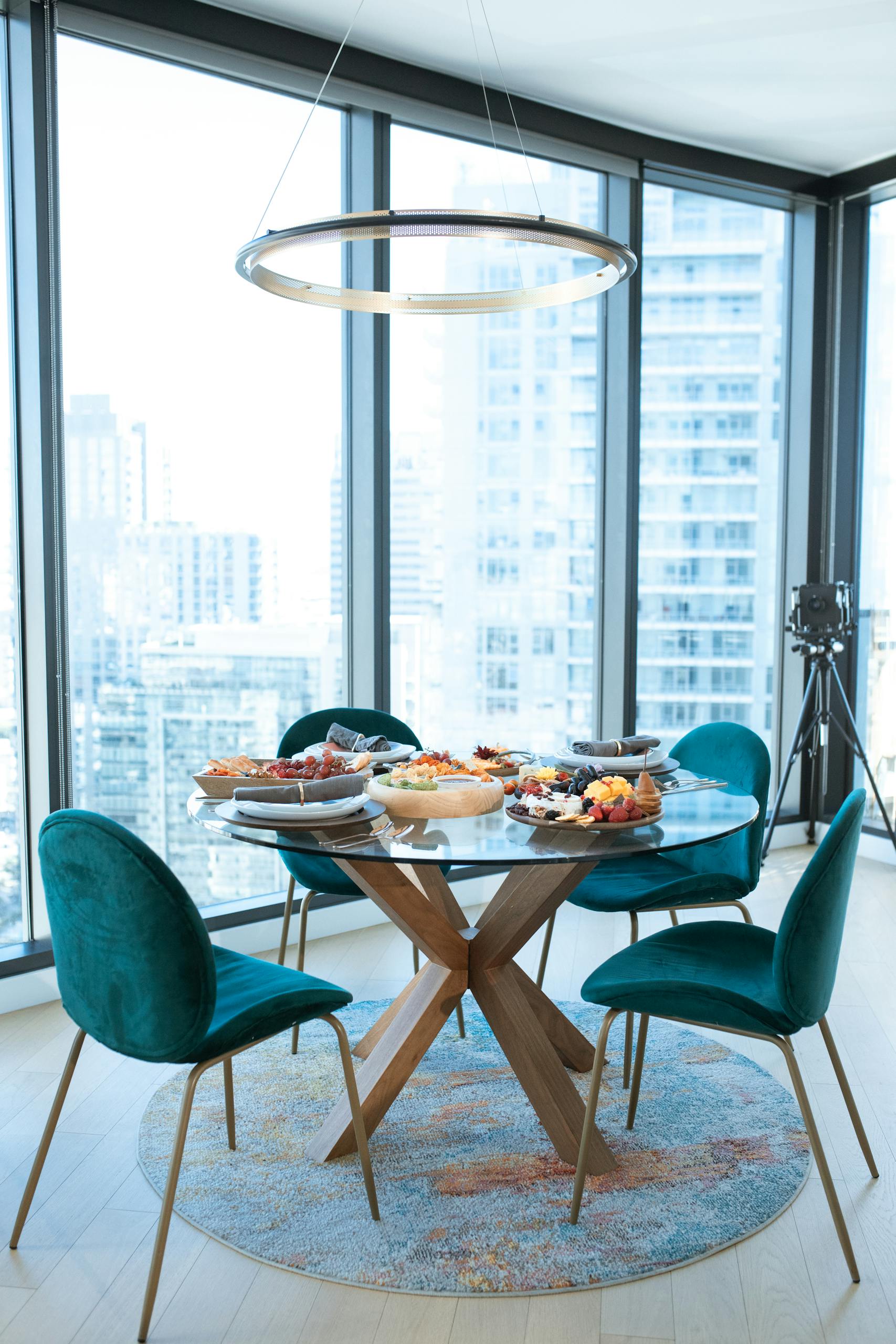 Luxurious indoor dining scene featuring charcuterie boards and city views.